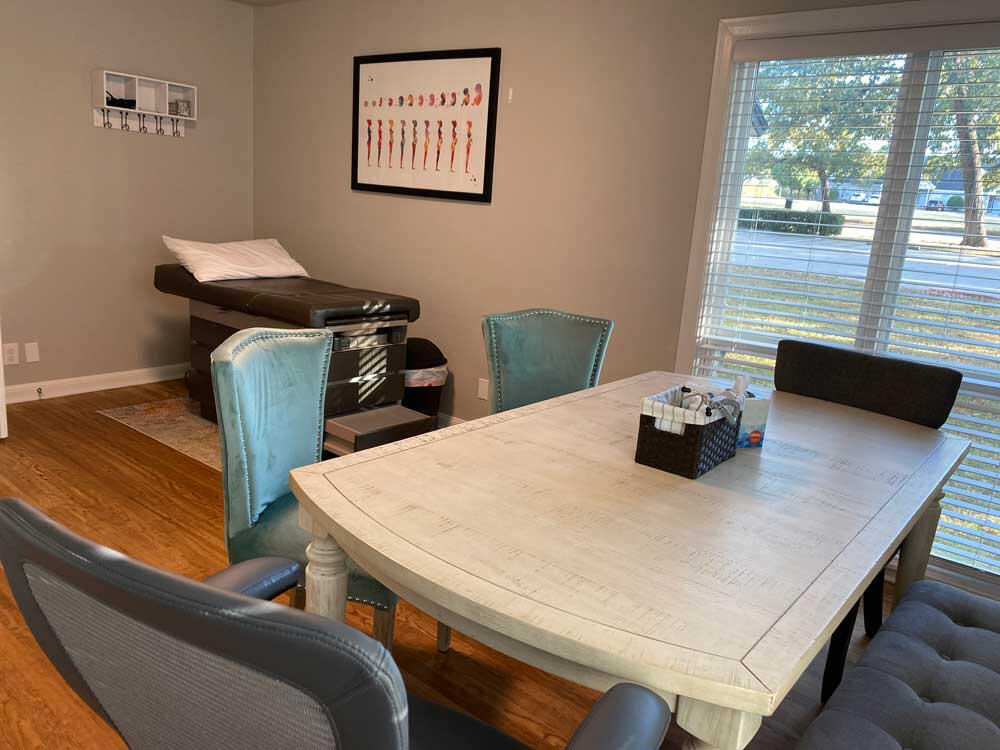 Our exam furnished with comfortable seating for our unhurried appointments as well as toys and books to entertain siblings.