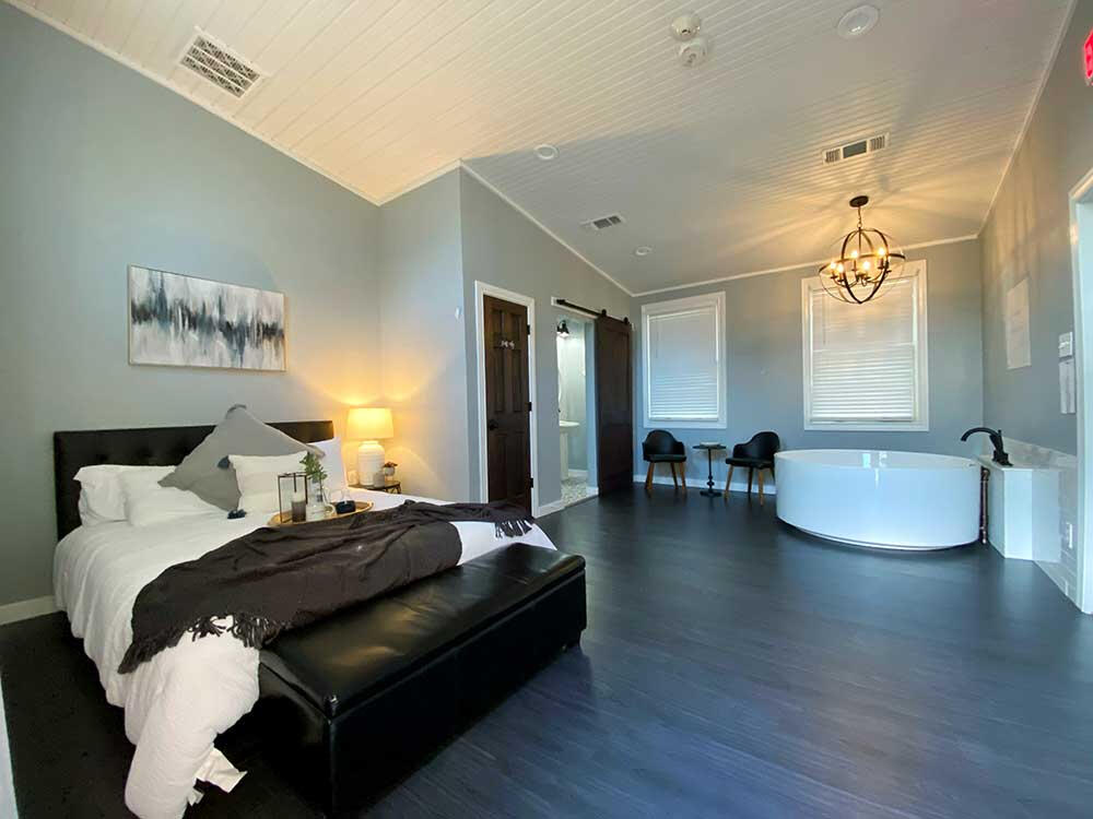 The Genesis Birth Suite features a beautiful, large, round tub and private bathroom with toilet and sink.